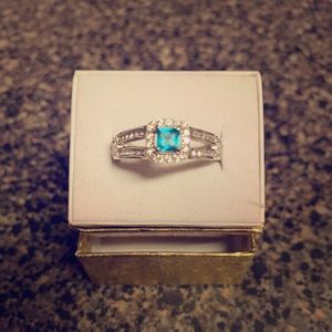 Lab created blue and white topaz ring.